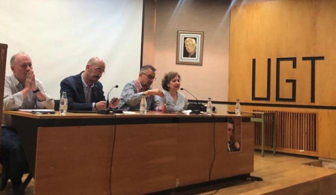 Fernando Luján, Faustino Temprano y Enrique Reguero en asamblea de León